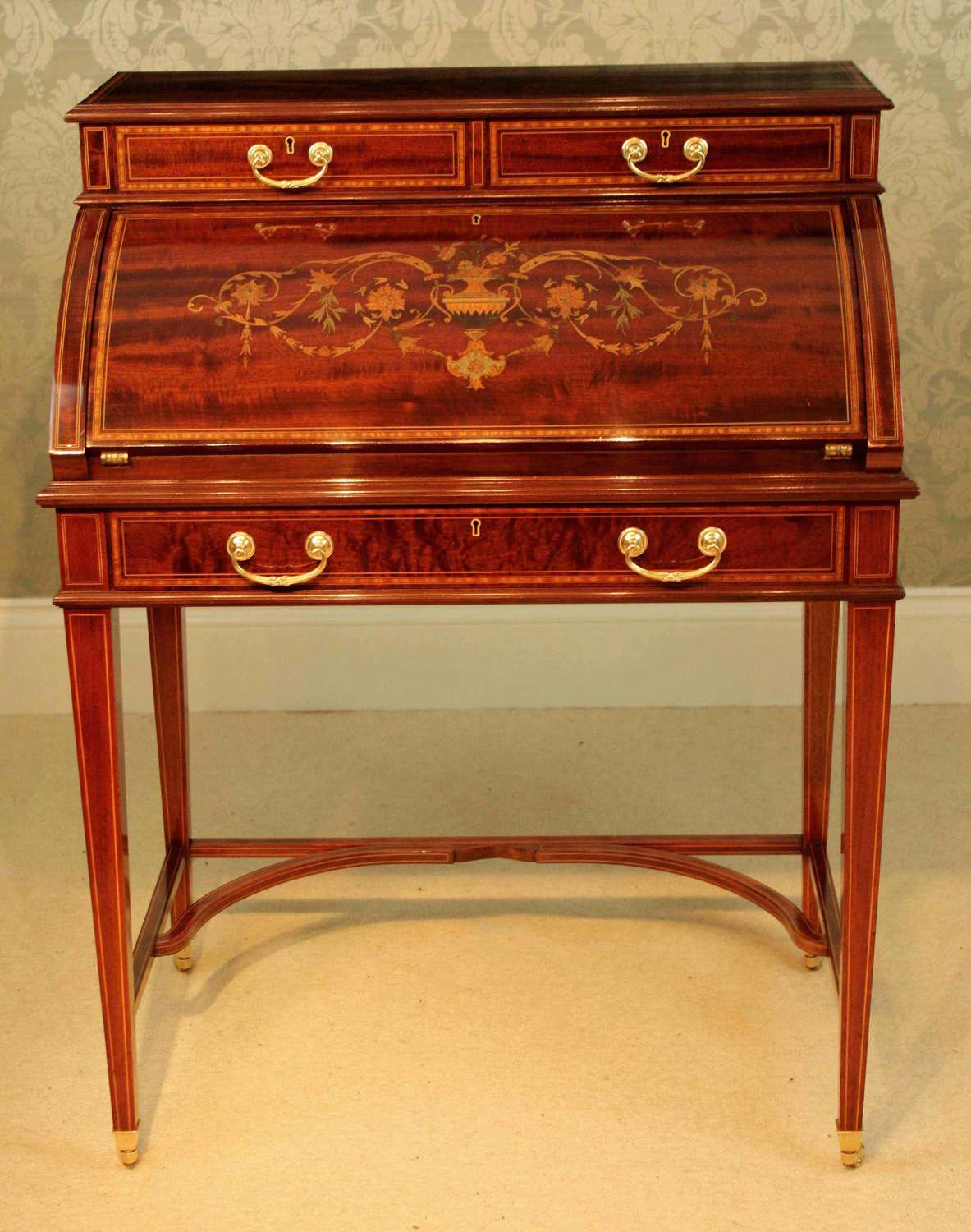 A Beautiful Late Victorian Mahogany cylinder desk by Maple & Co.