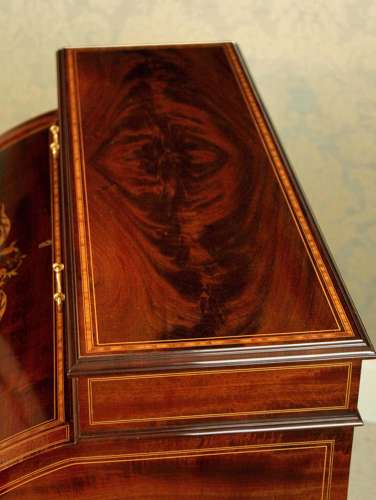 A Beautiful Late Victorian Mahogany cylinder desk by Maple & Co.