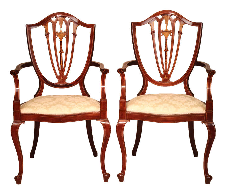 A Pair of Late Victorian Mahogany inlaid shield back armchairs