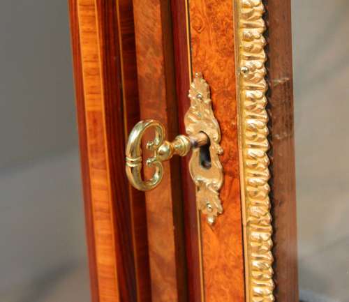 A Victorian Inlaid Burr-Walnut and Ormolu Mounted Pier Cabinet