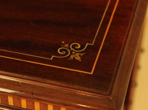 A Late Victorian Mahogany inlaid revolving bookcase by Maple & Co