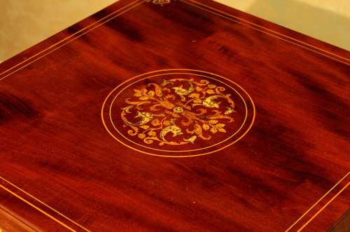 A Late Victorian Mahogany inlaid revolving bookcase by Maple & Co