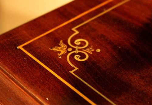 A Late Victorian Mahogany inlaid revolving bookcase by Maple & Co