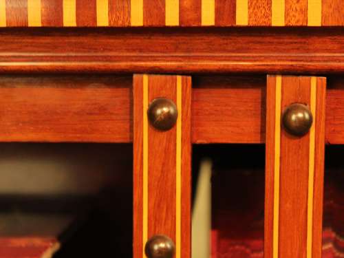 A Late Victorian Mahogany inlaid revolving bookcase by Maple & Co