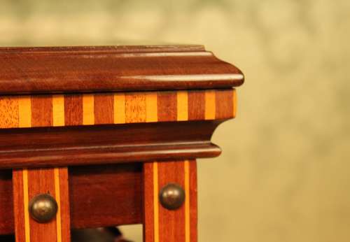 A Late Victorian Mahogany inlaid revolving bookcase by Maple & Co
