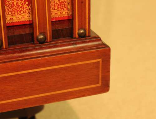 A Late Victorian Mahogany inlaid revolving bookcase by Maple & Co
