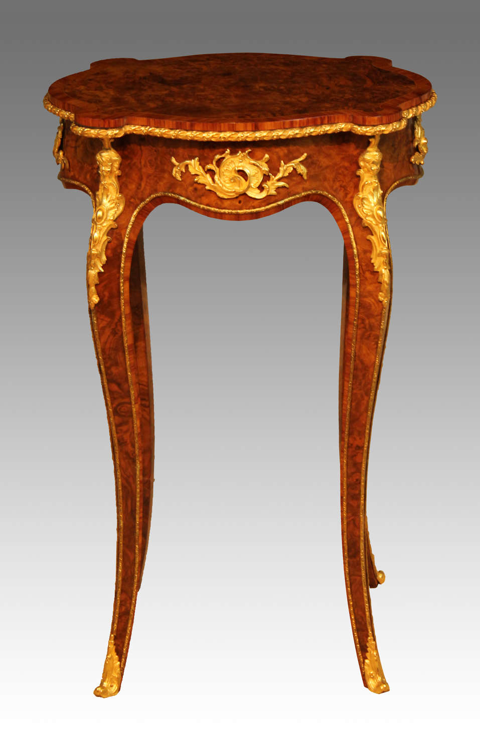 A Victorian Burr Walnut Inlaid and Ormolu Mounted Table