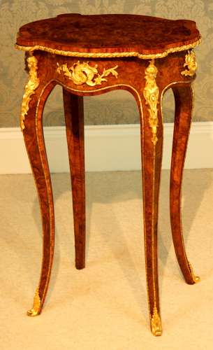 A Victorian Burr Walnut Inlaid and Ormolu Mounted Table