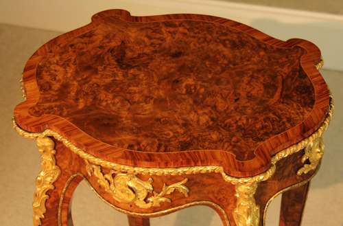 A Victorian Burr Walnut Inlaid and Ormolu Mounted Table
