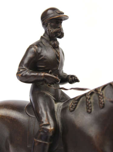 A 19th Century Bronze sculpture of a jockey and horse