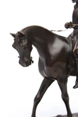 A 19th Century Bronze sculpture of a jockey and horse