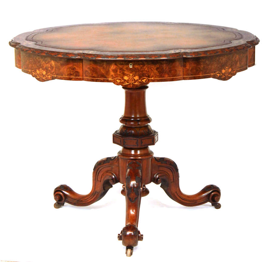 A Victorian Inlaid and Carved Walnut Drum Table