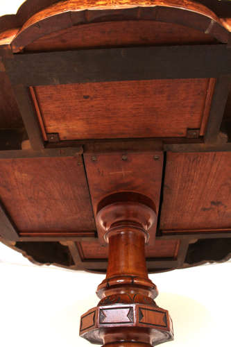 A Victorian Inlaid and Carved Walnut Drum Table