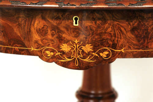 A Victorian Inlaid and Carved Walnut Drum Table