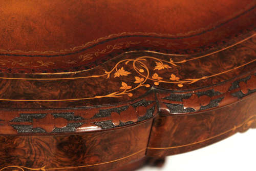A Victorian Inlaid and Carved Walnut Drum Table