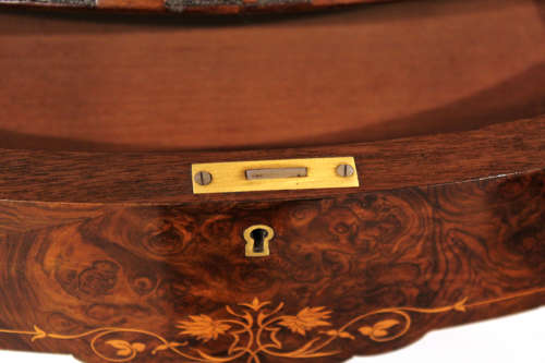 A Victorian Inlaid and Carved Walnut Drum Table