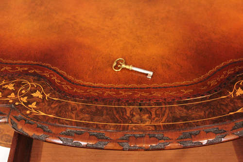 A Victorian Inlaid and Carved Walnut Drum Table