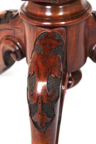 A Victorian Inlaid and Carved Walnut Drum Table