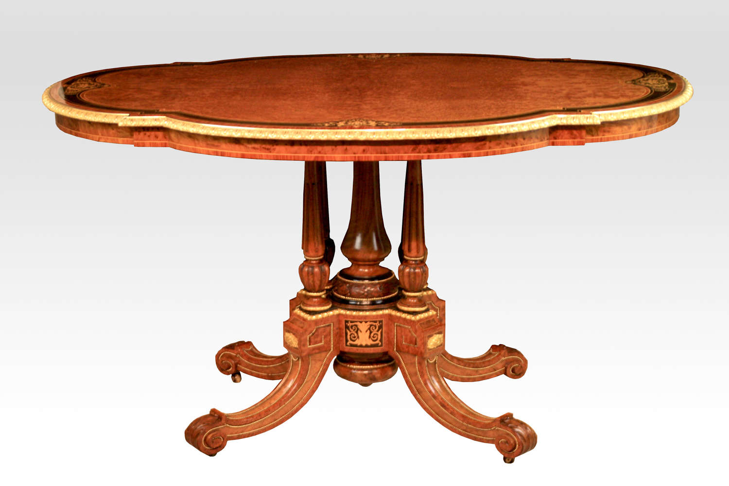 A Gillows Victorian Burr-walnut and Amboyna Mounted Centre Table