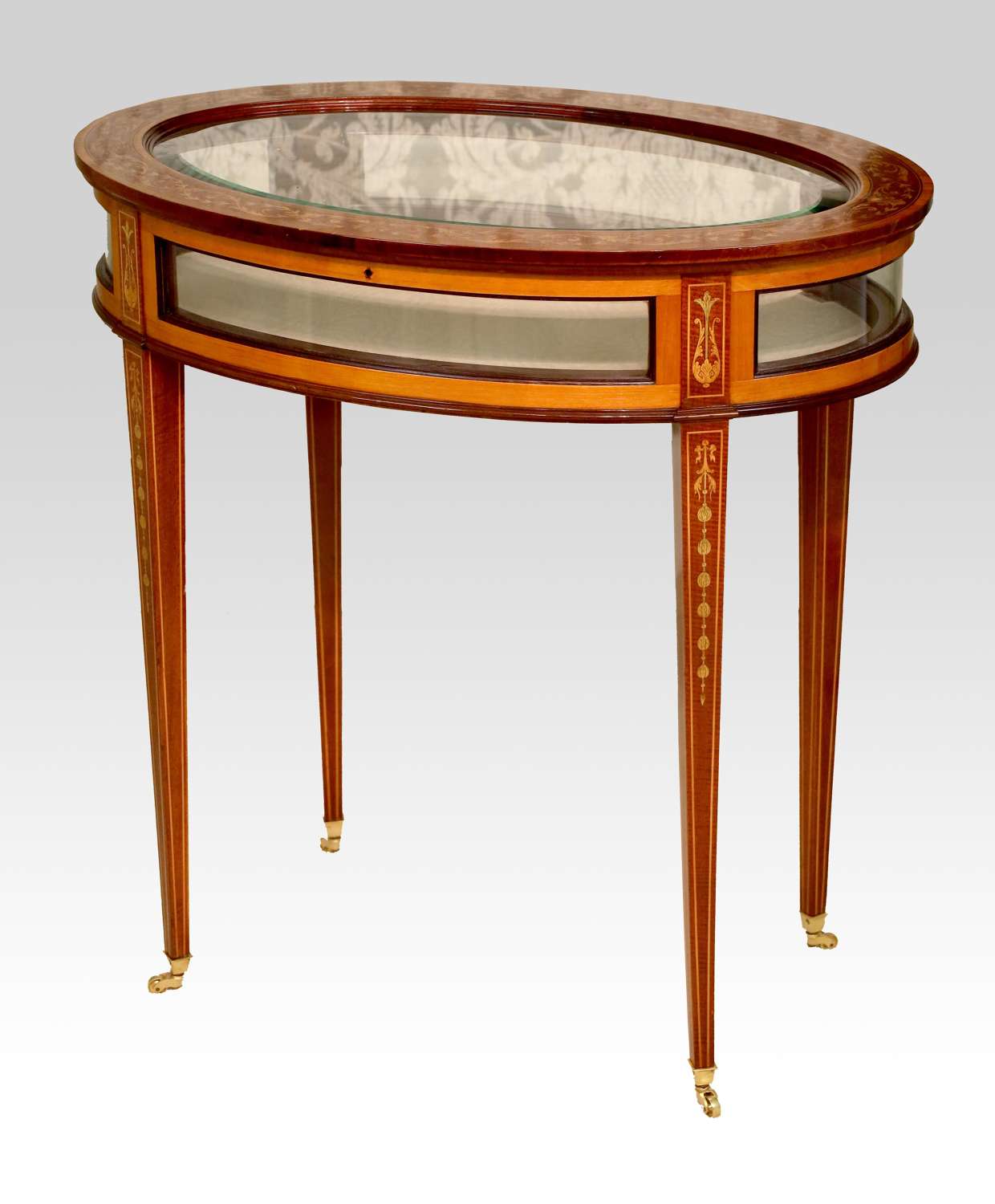 An Edwards & Roberts Victorian Mahogany Inlaid Oval Bijouterie Table