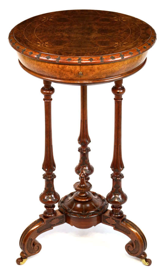 A Victorian Walnut Circular Work Table in the Manner of Gillows