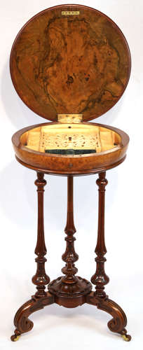 A Victorian Walnut Circular Work Table in the Manner of Gillows