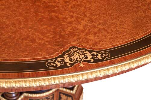 Att Gillows, A Victorian Burr Walnut And Amboyna Mounted Centre Table