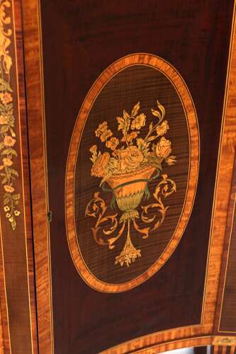 A Superb Late Victorian Mahogany Inlaid Serpentine Commode